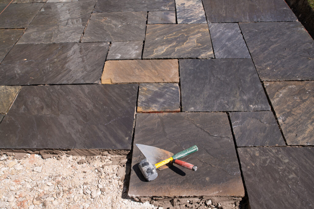 Indian,Stone,Patio,Under,Construction Laying limestone pavers in Chester