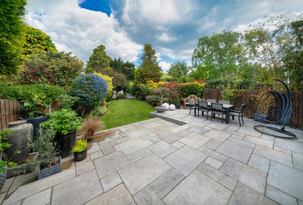 Beautiful,Summer,Garden,In,England,,Uk,With,Lawn,And,Large, Paving in Llandudno