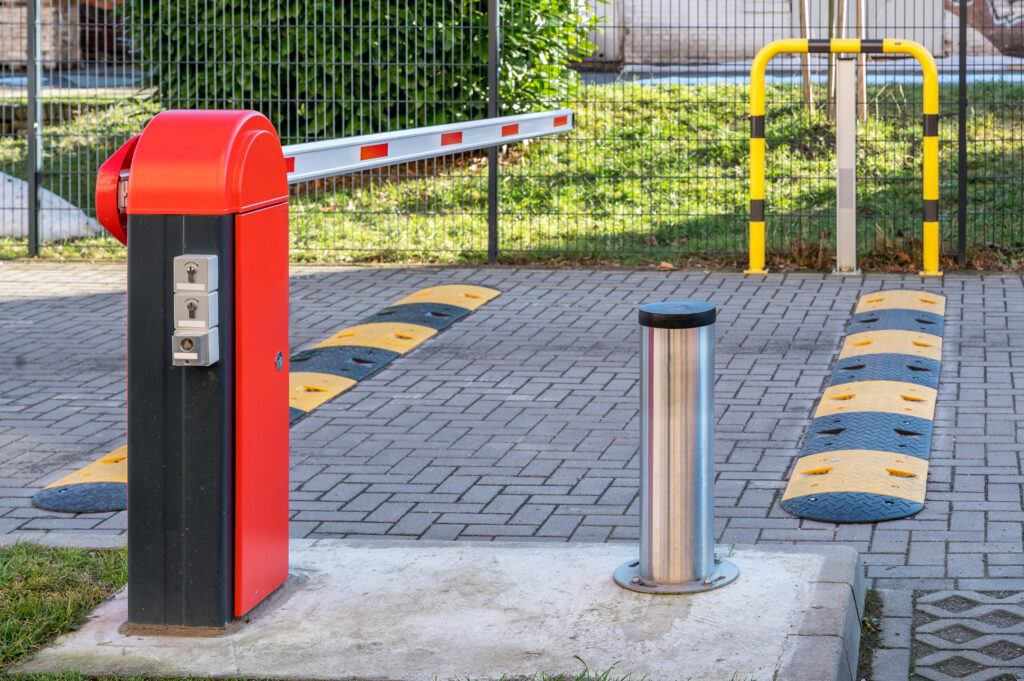 Electric,Barrier,And,Speed,Bumps,At,The,Entrance,To,A Bollards installed